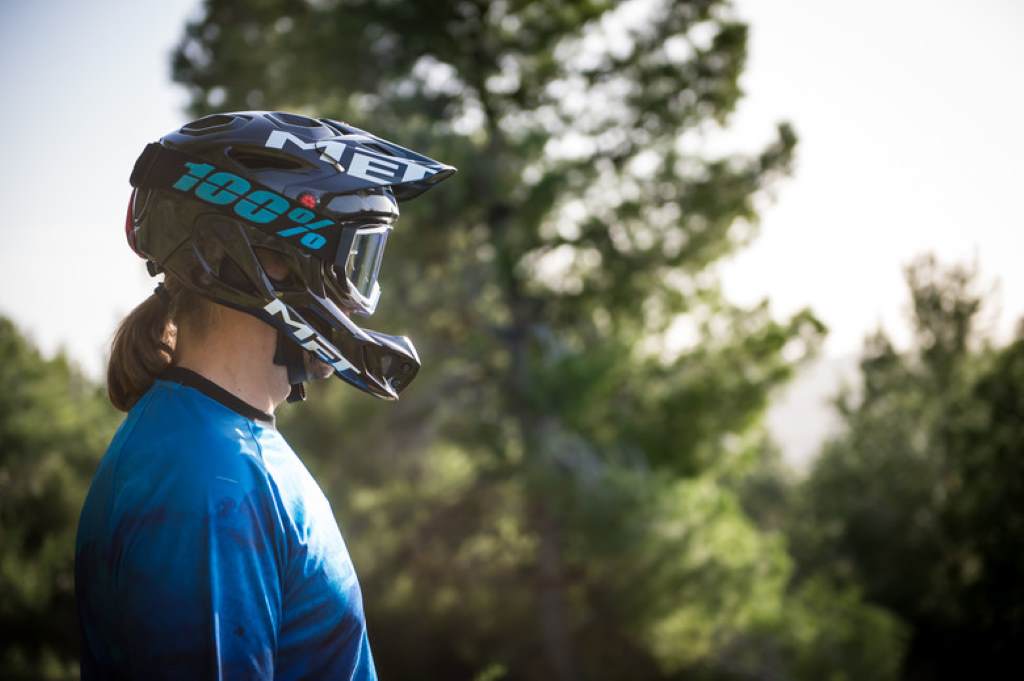 Selection of certified affordable bike helmets displayed on a store shelf, highlighting ventilation vents and safety labels.