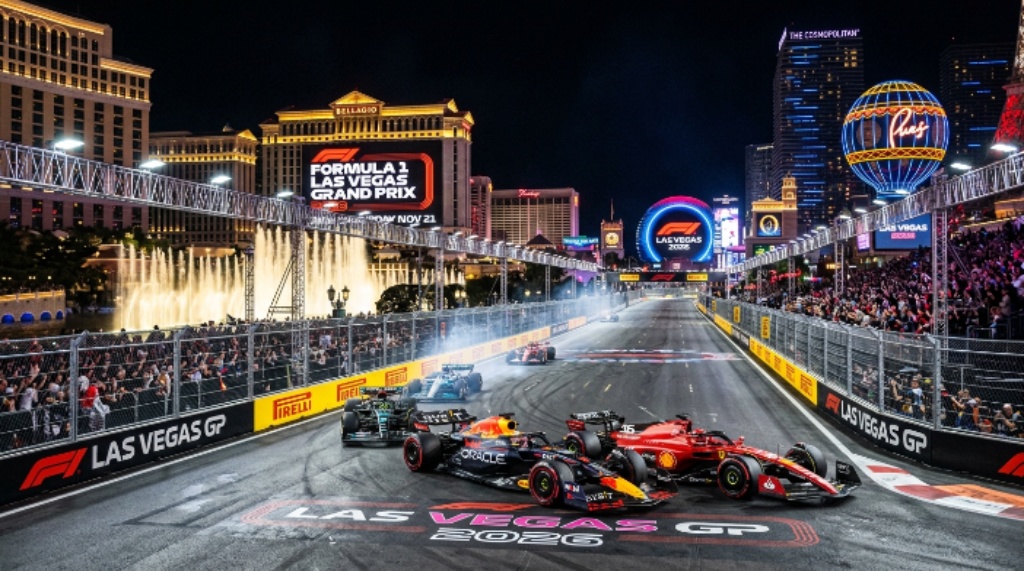 Formula 1 cars racing down the illuminated Las Vegas Strip at night during the 2026 Las Vegas Grand Prix on Saturday November 21